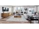 Inviting living room with large windows, neutral decor, stylish furniture, and hardwood flooring at 591 Dalton Way, Avon, IN 46123
