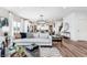 Open-concept layout showcases a seamless transition from the living room to the kitchen and dining area at 591 Dalton Way, Avon, IN 46123
