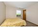 Simple bedroom featuring neutral paint, carpet, and a window with blinds at 6138 Bartley Ct, Indianapolis, IN 46236