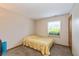 Simple bedroom featuring neutral paint, carpet, and a window with blinds at 6138 Bartley Ct, Indianapolis, IN 46236