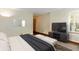 A staged bedroom with a TV and modern furniture offers a relaxing retreat at 6138 Bartley Ct, Indianapolis, IN 46236