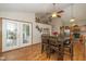 An inviting space features a ceiling fan, a dining table and an open concept kitchen with a view of the outdoor at 6138 Bartley Ct, Indianapolis, IN 46236