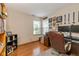 Comfortable home office featuring desk, leather chair, and hardwood floors at 6138 Bartley Ct, Indianapolis, IN 46236