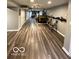 Spacious basement featuring a bar area, stylish seating, and sleek, modern flooring at 6155 W Bayfront, McCordsville, IN 46055