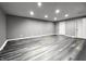 Open finished basement featuring laminated wood flooring and recessed lighting at 6155 W Bayfront, McCordsville, IN 46055