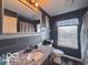 Modern bathroom featuring vanity with granite countertop, and tiled wall at 6155 W Bayfront, McCordsville, IN 46055