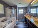 Bathroom features a double vanity, soaking tub, glass enclosed shower, and great natural light at 6155 W Bayfront, McCordsville, IN 46055