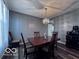 Elegant dining room features a chandelier, stylish decor, and comfortable seating at 6155 W Bayfront, McCordsville, IN 46055