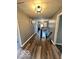 Hallway with hardwood floors leading to the stairs at 6155 W Bayfront, McCordsville, IN 46055