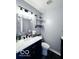 Stylish half bath with modern sink, vanity, and shelving at 6155 W Bayfront, McCordsville, IN 46055