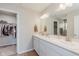 Elegant bathroom with double vanities, a large mirror, and a walk-in closet at 6460 Wasco Dr, Whitestown, IN 46075