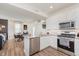 Modern kitchen with stainless steel appliances, granite countertops and adjoining dining area at 6460 Wasco Dr, Whitestown, IN 46075