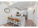 Modern kitchen featuring white cabinets, stainless steel appliances, granite countertops, and luxury vinyl plank flooring at 6460 Wasco Dr, Whitestown, IN 46075