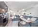 Open concept living room area with luxury vinyl plank flooring, stylish accent wall, and lots of natural light at 6460 Wasco Dr, Whitestown, IN 46075