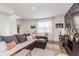 Bright living room with views of front yard and an open concept view of the kitchen at 6460 Wasco Dr, Whitestown, IN 46075