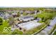 Aerial view of community pool, clubhouse, and surrounding neighborhood at 6648 Westminster Dr, Zionsville, IN 46077