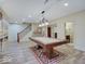 Finished basement with a billiards table, staircase and wet bar, perfect for entertainment and relaxation at 6648 Westminster Dr, Zionsville, IN 46077