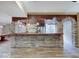 Basement bar with brick and wood accents, adding a unique, rustic charm to the living space at 6648 Westminster Dr, Zionsville, IN 46077