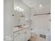Bright bathroom with a shower/tub combination and granite countertops at 6648 Westminster Dr, Zionsville, IN 46077