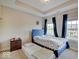 Bedroom features blue accents, carpet flooring, and a large window with bright curtains at 6648 Westminster Dr, Zionsville, IN 46077