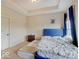Cozy bedroom featuring a blue headboard, soft carpet, and bright natural light at 6648 Westminster Dr, Zionsville, IN 46077