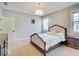 Bedroom with light walls, neutral carpet, and two windows at 6648 Westminster Dr, Zionsville, IN 46077