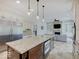 Gourmet kitchen features a large island, stainless steel appliances, and open layout at 6648 Westminster Dr, Zionsville, IN 46077
