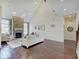 Large living room with a stone fireplace, high ceilings, and plenty of natural light at 6648 Westminster Dr, Zionsville, IN 46077