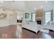 Spacious living room with stone fireplace and recessed lighting offers comfortable seating at 6648 Westminster Dr, Zionsville, IN 46077