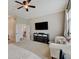 Bedroom featuring a large TV, dresser, a chaise lounge, and neutral carpeting at 6648 Westminster Dr, Zionsville, IN 46077