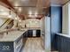 A granite countertop wet bar provides elegance and style to a well-equipped basement area at 6648 Westminster Dr, Zionsville, IN 46077
