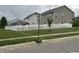 View of the vinyl fenced backyard and lawn at 6836 Eagle Crossing Blvd, Brownsburg, IN 46112