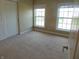 Bedroom with neutral carpet and wall colors and natural light at 6836 Eagle Crossing Blvd, Brownsburg, IN 46112