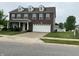 Two-story brick home with a two-car garage, front yard, and mature landscaping at 6836 Eagle Crossing Blvd, Brownsburg, IN 46112