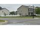View of the home's side and backyard with vinyl fencing at 6836 Eagle Crossing Blvd, Brownsburg, IN 46112