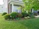 Landscaped front garden with flowering plants and manicured shrubs at 6836 Eagle Crossing Blvd, Brownsburg, IN 46112