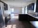 Updated kitchen showcases dark wood cabinets, stainless appliances, and an open layout at 6836 Eagle Crossing Blvd, Brownsburg, IN 46112
