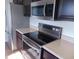 Kitchen view showing stainless steel appliances including range and refrigerator at 6836 Eagle Crossing Blvd, Brownsburg, IN 46112