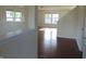 Bright living room with wood flooring and large windows at 6836 Eagle Crossing Blvd, Brownsburg, IN 46112