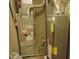 Image shows a Bryant HVAC system and a hot water heater in the home's utility room at 6836 Eagle Crossing Blvd, Brownsburg, IN 46112