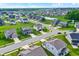 Aerial shot of residential area featuring homes, ponds, and green spaces, offering a serene living environment at 6843 Black Cherry Ter, Brownsburg, IN 46112