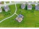 Aerial view of a community playground with modern equipment surrounded by sidewalks and lush green space at 6843 Black Cherry Ter, Brownsburg, IN 46112