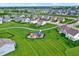 Aerial view showcasing a neighborhood park and green space with community homes, enhancing the appeal at 6843 Black Cherry Ter, Brownsburg, IN 46112