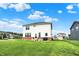 A large backyard features a two-story home and an outdoor picnic table at 6843 Black Cherry Ter, Brownsburg, IN 46112