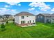 Spacious backyard featuring a patio, green lawn, and siding at 6843 Black Cherry Ter, Brownsburg, IN 46112