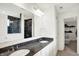 Bathroom features a double sink with granite countertop and tiled shower at 6843 Black Cherry Ter, Brownsburg, IN 46112