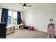 Bright bedroom features a ceiling fan and plenty of space for play at 6843 Black Cherry Ter, Brownsburg, IN 46112