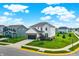 Aerial view of a two-story home with a two-car garage, manicured lawn, and established landscaping at 6843 Black Cherry Ter, Brownsburg, IN 46112