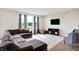 Bright and airy living room with a comfortable sectional sofa, large window, and modern entertainment setup at 6843 Black Cherry Ter, Brownsburg, IN 46112
