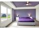 Spacious main bedroom with large window and purple accent wall at 6843 Black Cherry Ter, Brownsburg, IN 46112